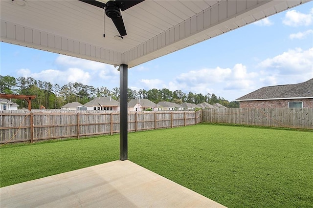 view of yard with a fenced backyard, a patio area, and a ceiling fan