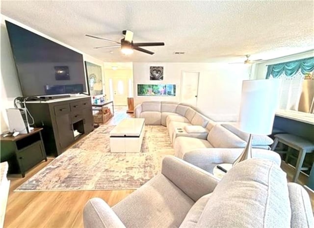 2516 E Pearl Dr, Marrero, LA 70072 - living room featuring ceiling fan, a textured ceiling, and wood finished floors