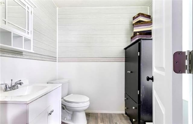 2516 E Pearl Dr, Marrero, LA 70072 - bathroom with vanity, wood finished floors, and toilet