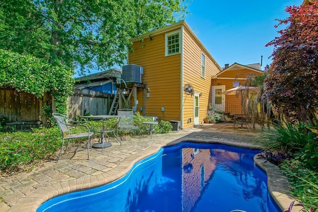 3611 Elaine Pl, New Orleans, LA 70119 - back of house featuring outdoor dining space, a patio, fence, and a fenced in pool