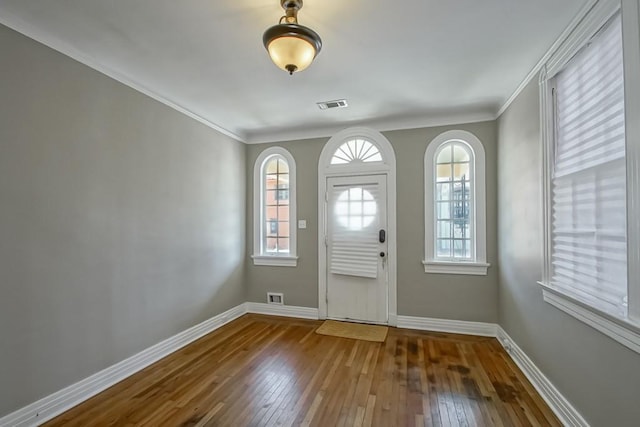 3611 Elaine Pl, New Orleans, LA 70119 - foyer featuring visible vents, hardwood / wood-style flooring, baseboards, and ornamental molding