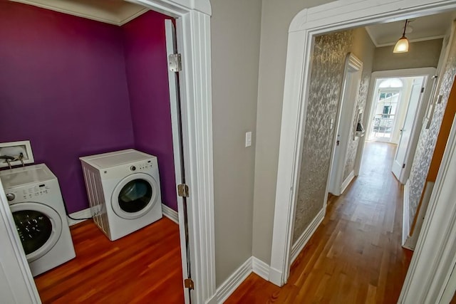 3611 Elaine Pl, New Orleans, LA 70119 - washroom featuring washer and clothes dryer, ornamental molding, and wood finished floors