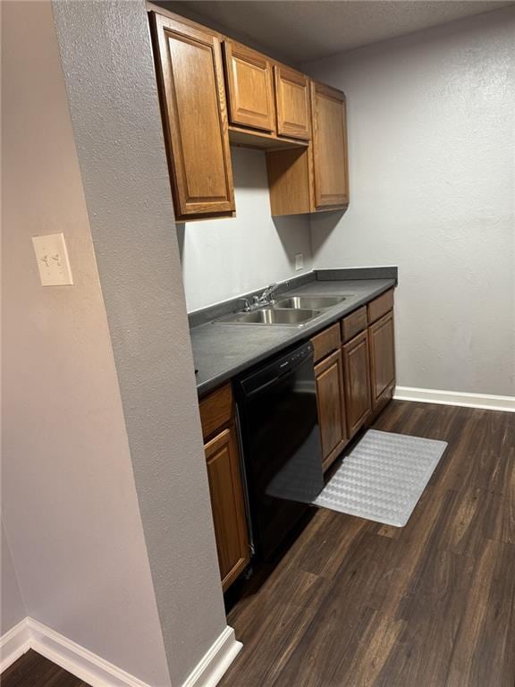 4518 Y A Tittle Ave Unit 6, Baton Rouge, LA 70820 - kitchen featuring dark wood-style flooring, baseboards, a sink, dark countertops, and black dishwasher
