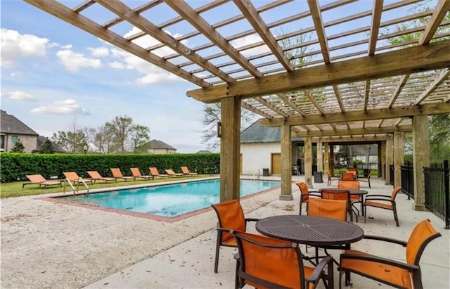 view of swimming pool with a patio area, a fenced in pool, fence, a pergola, and outdoor dining space