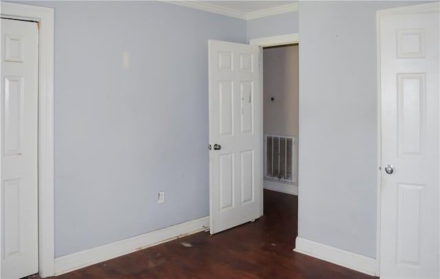 41158 2nd Colonial St, Prairieville, LA 70769 - unfurnished bedroom featuring baseboards, visible vents, wood finished floors, and ornamental molding