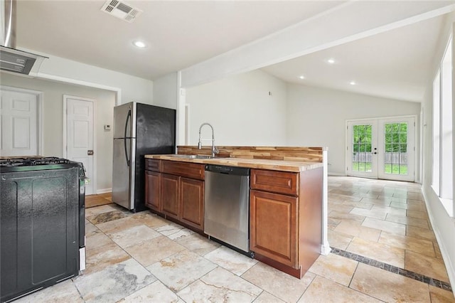 4741 Lafon Dr, New Orleans, LA 70126 - kitchen with visible vents, appliances with stainless steel finishes, lofted ceiling, a sink, and brown cabinetry