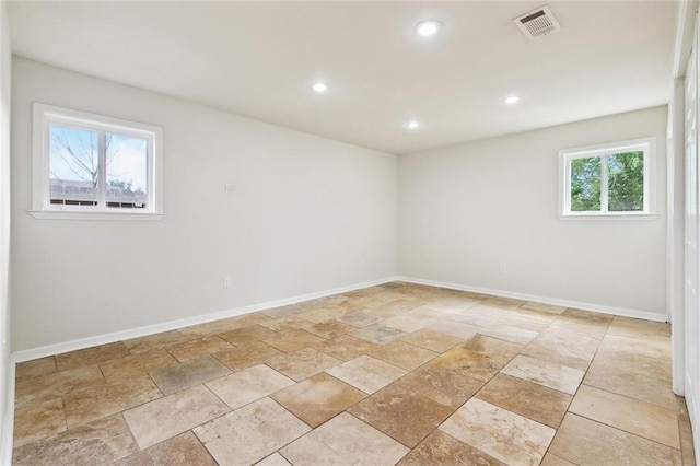 4741 Lafon Dr, New Orleans, LA 70126 - spare room with recessed lighting, stone finish floor, baseboards, and visible vents