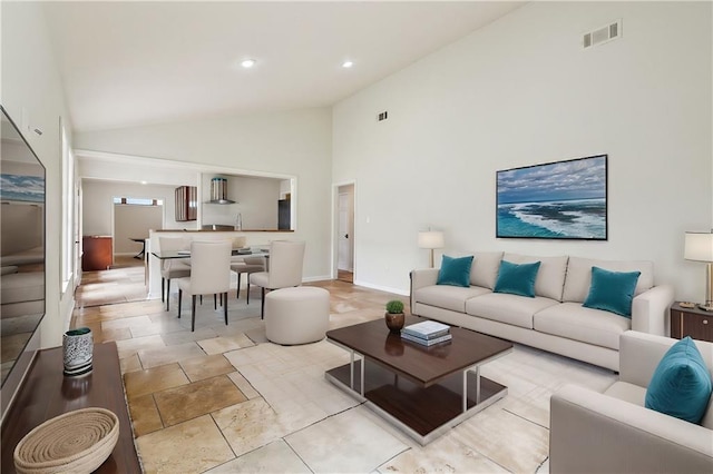 4741 Lafon Dr, New Orleans, LA 70126 - living area featuring recessed lighting, high vaulted ceiling, baseboards, and visible vents