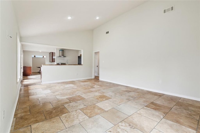4741 Lafon Dr, New Orleans, LA 70126 - unfurnished living room with baseboards, high vaulted ceiling, and visible vents