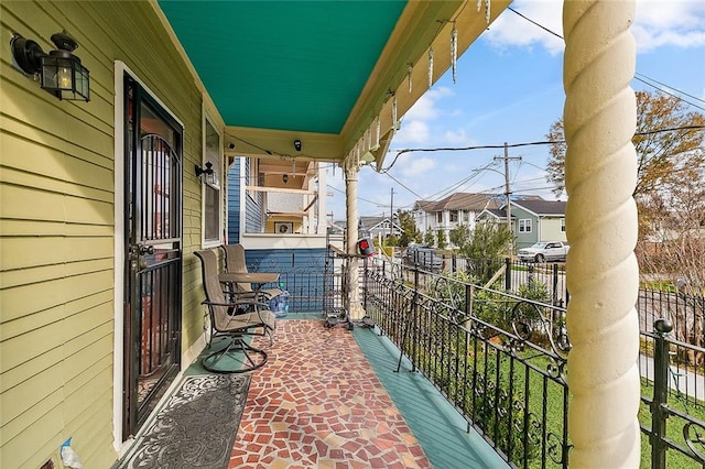 3212 Milan St, New Orleans, LA 70125 - covered porch featuring a residential view