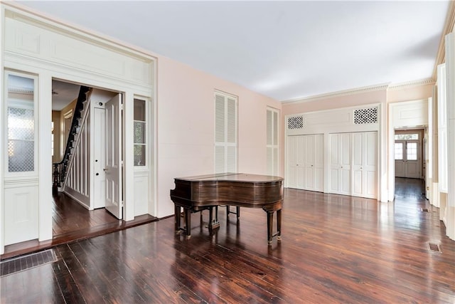 entryway with wood finished floors and visible vents