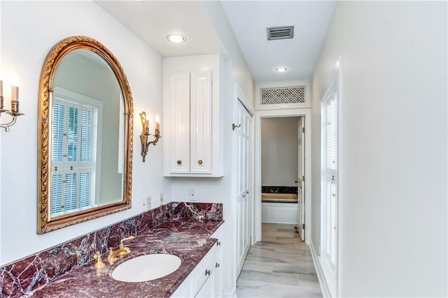 bathroom featuring recessed lighting, visible vents, marble finish floor, and vanity