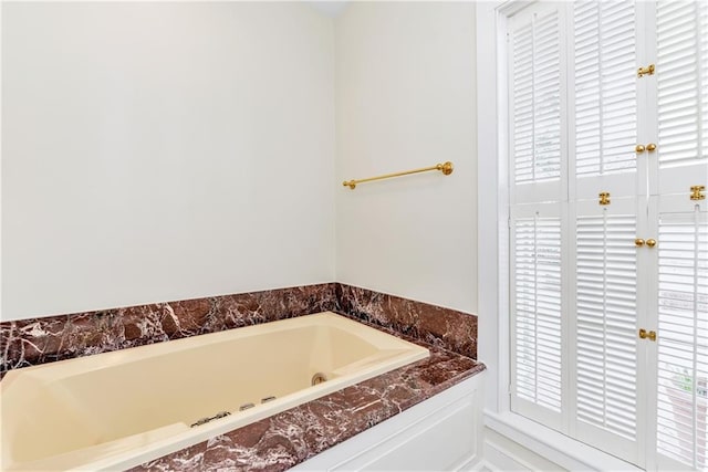 full bathroom with a garden tub