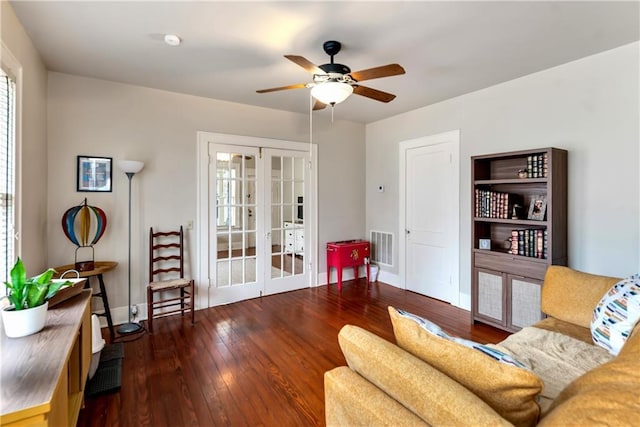 living room with french doors, baseboards, visible vents, a ceiling fan, and hardwood / wood-style flooring