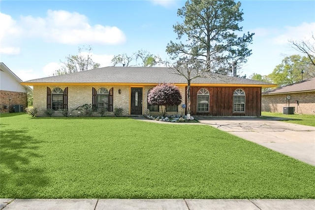 9180 Dancy Ave, Baton Rouge, LA 70814 - ranch-style house with a front lawn, central AC unit, and concrete driveway