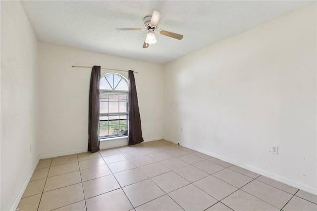 9180 Dancy Ave, Baton Rouge, LA 70814 - spare room with a textured ceiling, ceiling fan, baseboards, and light tile patterned floors