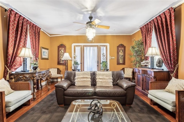 1830 Burgundy St, New Orleans, LA 70116 - living room featuring wood finished floors, a ceiling fan, healthy amount of natural light, and crown molding