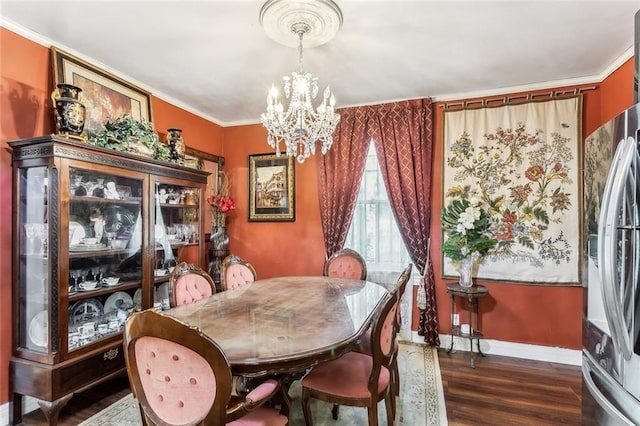 1830 Burgundy St, New Orleans, LA 70116 - dining area with a chandelier, wood finished floors, and ornamental molding