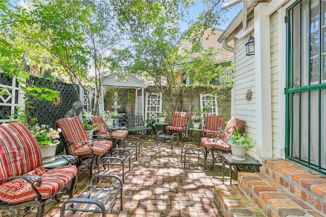 1830 Burgundy St, New Orleans, LA 70116 - fenced backyard with a patio