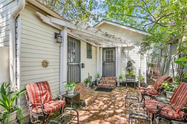 1830 Burgundy St, New Orleans, LA 70116 - view of patio / terrace with entry steps and a pergola