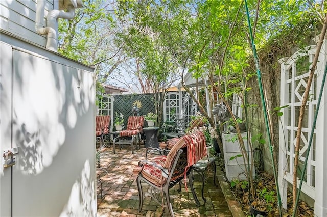 1830 Burgundy St, New Orleans, LA 70116 - wooden deck featuring a patio area