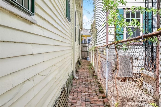 1830 Burgundy St, New Orleans, LA 70116 - view of side of home featuring a fenced backyard