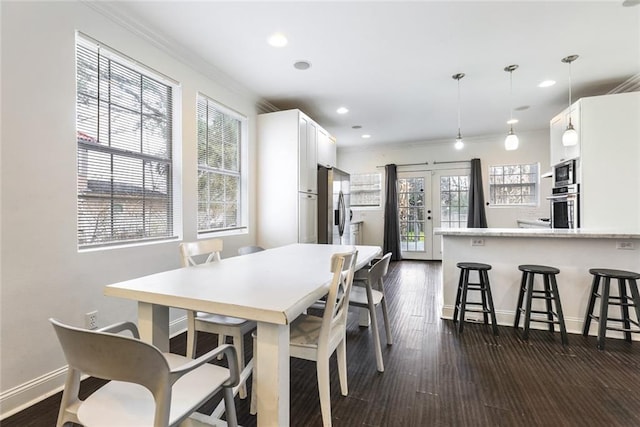 3415 Louisiana Ave Parkway, New Orleans, LA 70125 - dining area with dark wood finished floors, crown molding, and plenty of natural light