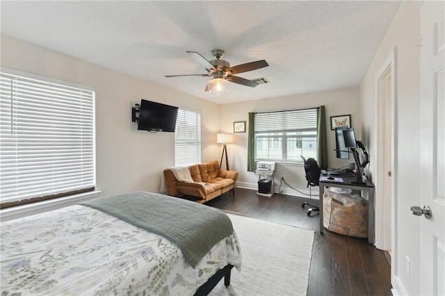 4719 Annunciation St Unit 4719, New Orleans, LA 70115 - bedroom featuring hardwood / wood-style floors, ceiling fan, a textured ceiling, a desk, and baseboards