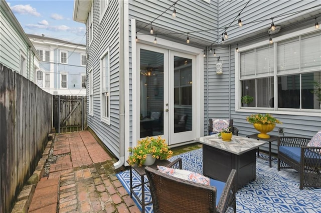 4719 Annunciation St Unit 4719, New Orleans, LA 70115 - fenced backyard with french doors, a patio area, and an outdoor living space