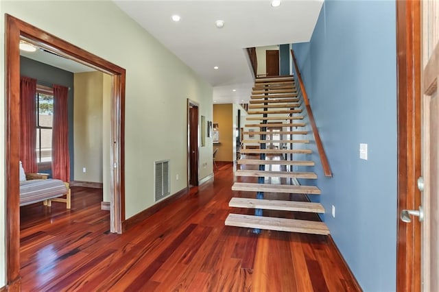 5533 Woodlawn Pl, New Orleans, LA 70124 - stairway featuring wood finished floors, baseboards, and recessed lighting