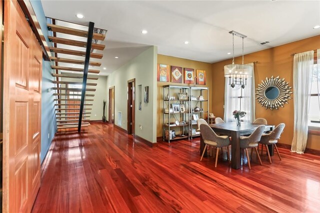 5533 Woodlawn Pl, New Orleans, LA 70124 - dining room with baseboards, healthy amount of natural light, wood finished floors, recessed lighting, and a chandelier
