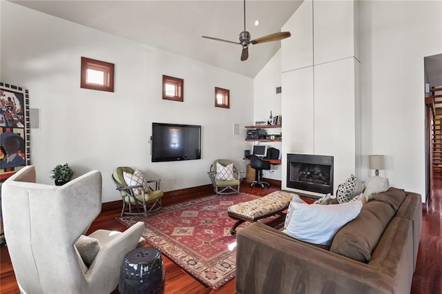 5533 Woodlawn Pl, New Orleans, LA 70124 - living room featuring wood finished floors, high vaulted ceiling, ceiling fan, and baseboards