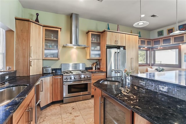 5533 Woodlawn Pl, New Orleans, LA 70124 - kitchen featuring high quality appliances, wall chimney range hood, a sink, wine cooler, and pendant lighting