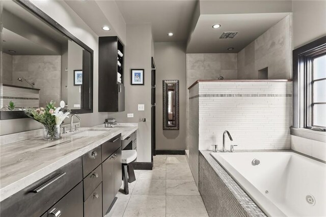 5533 Woodlawn Pl, New Orleans, LA 70124 - bathroom with recessed lighting, a jetted tub, vanity, baseboards, and a tile shower