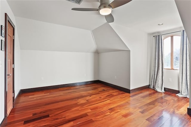 5533 Woodlawn Pl, New Orleans, LA 70124 - additional living space with a ceiling fan, wood finished floors, baseboards, and vaulted ceiling