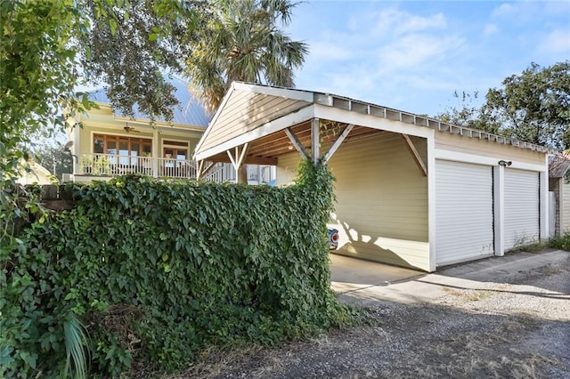 5533 Woodlawn Pl, New Orleans, LA 70124 - garage with ceiling fan and a garage
