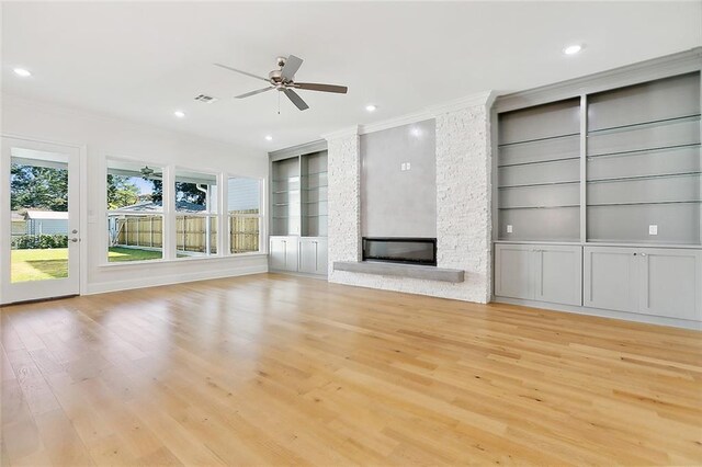 753 Jefferson Heights Ave, Jefferson, LA 70121 - unfurnished living room with ornamental molding, built in features, light wood-style floors, ceiling fan, and recessed lighting