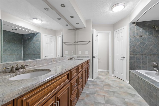 10 Heritage Ln Unit 38, New Orleans, LA 70114 - bathroom with double vanity and a textured ceiling