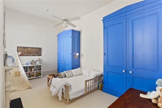 bedroom with carpet flooring and a ceiling fan