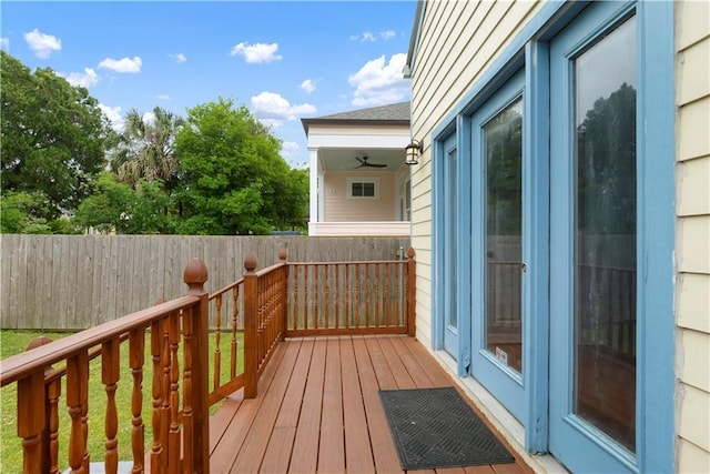 wooden terrace featuring fence