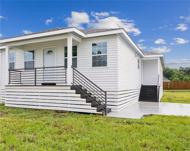 view of front of house with a front lawn and a porch