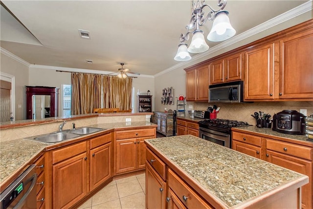 18201 Pine Ridge Dr, Prairieville, LA 70769 - kitchen with visible vents, brown cabinetry, appliances with stainless steel finishes, tile countertops, and backsplash