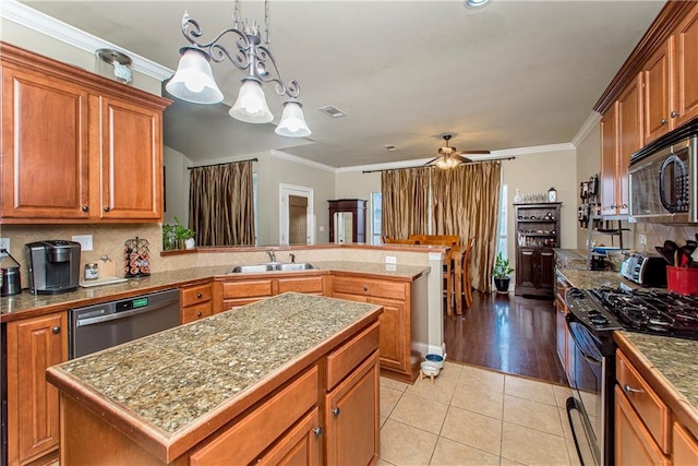 18201 Pine Ridge Dr, Prairieville, LA 70769 - kitchen with a sink, stainless steel dishwasher, light tile patterned floors, range with gas stovetop, and ornamental molding