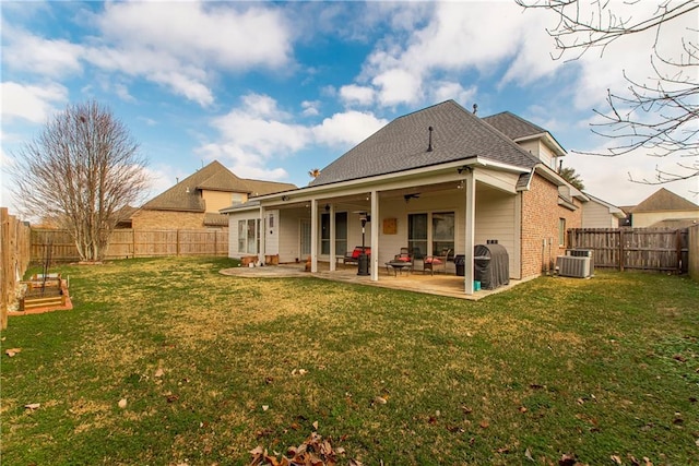 18201 Pine Ridge Dr, Prairieville, LA 70769 - rear view of property with a patio area, brick siding, a fenced backyard, central AC, and a yard