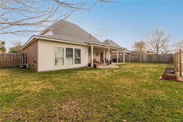 18201 Pine Ridge Dr, Prairieville, LA 70769 - rear view of property with a fenced backyard, a lawn, and a patio area