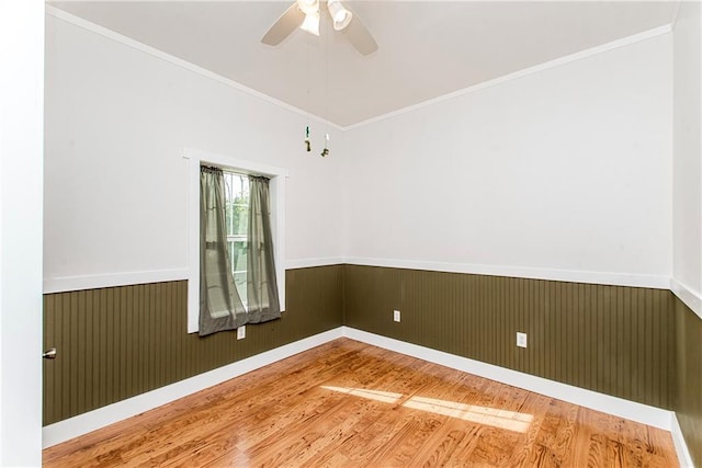 34310 Bluff Line Rd, Independence, LA 70443 - unfurnished room with a ceiling fan, wood finished floors, ornamental molding, and wainscoting