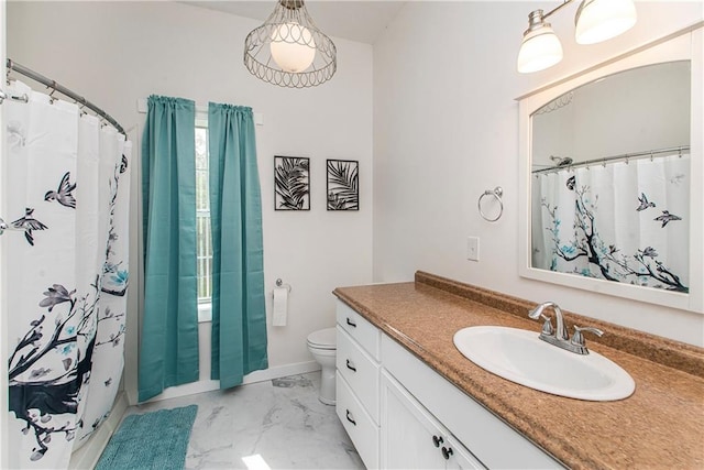 34310 Bluff Line Rd, Independence, LA 70443 - full bathroom with a shower with shower curtain, baseboards, marble finish floor, toilet, and vanity