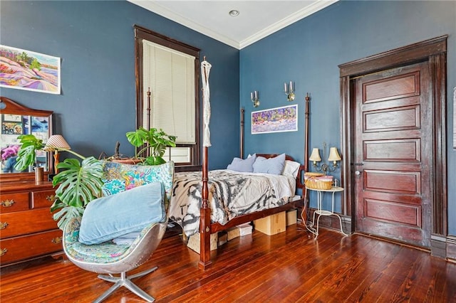 bedroom featuring wood-type flooring and ornamental molding