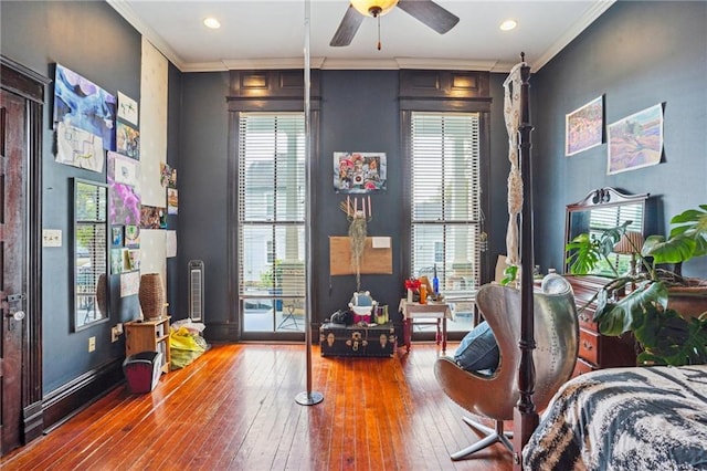 bedroom with hardwood / wood-style floors and crown molding
