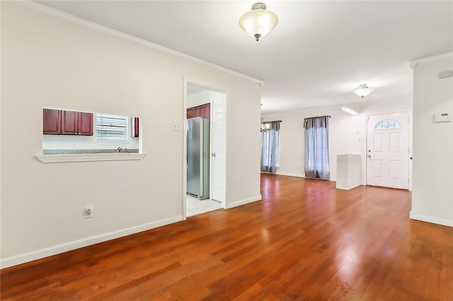 13118 Lemans St, New Orleans, LA 70129 - empty room with crown molding, wood finished floors, and baseboards
